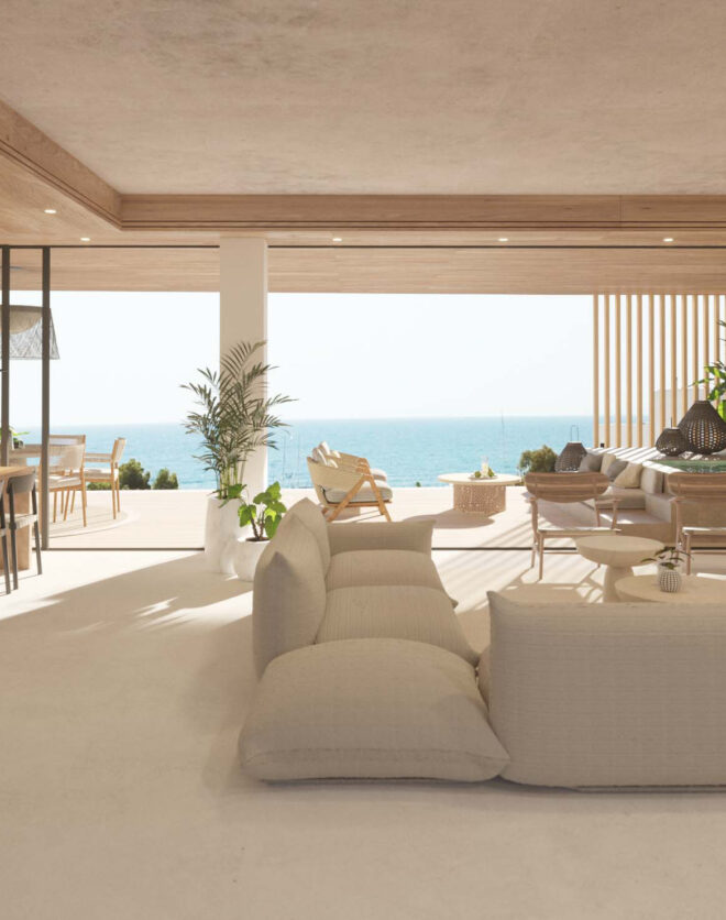 Floor-to-ceiling glazing slides away to accentuate sea views form a luxury apartment for sale in Ibiza