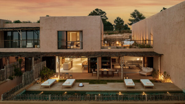 Luxury complex in Ibiza, backdropped by the setting sun