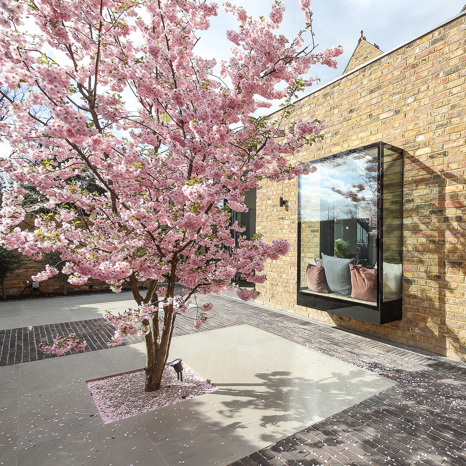 Alexandra Noble cherry blossom courtyard