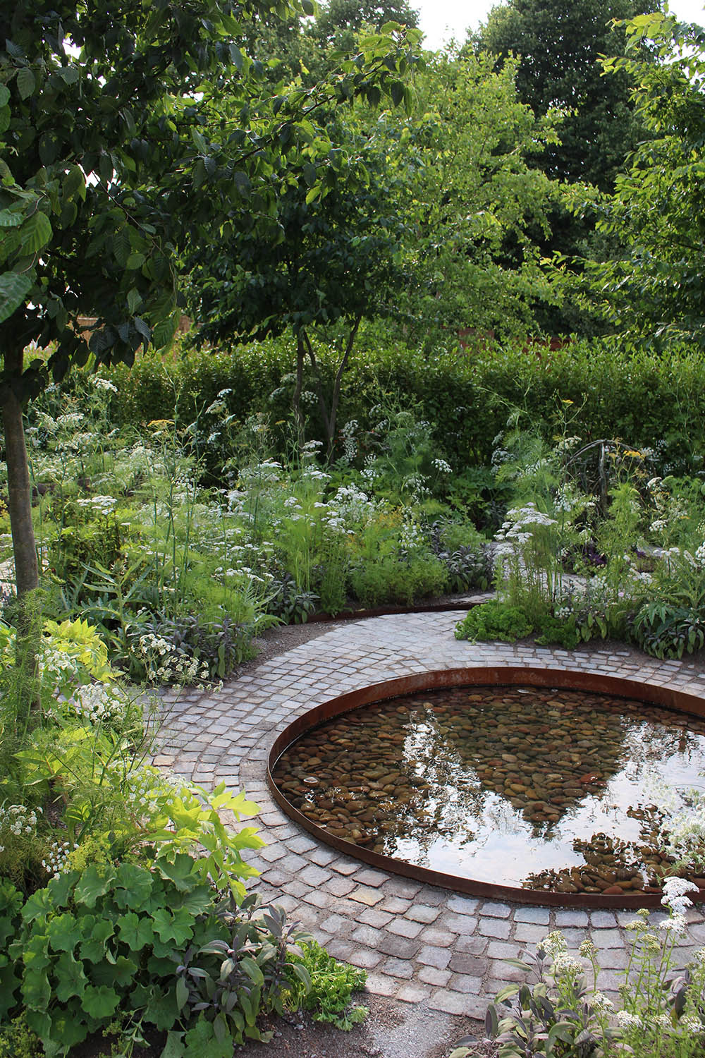 Luxury garden design and pond by Alexandra Noble
