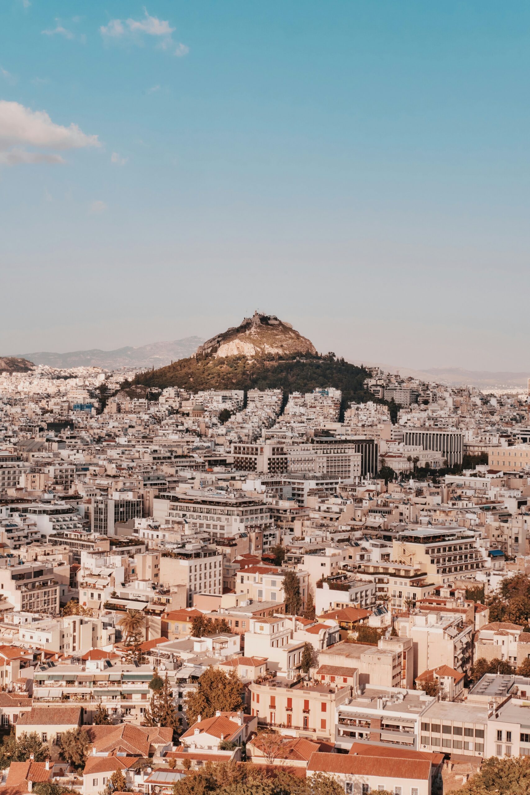 The Athens acropolis rising above the city, for Barnes International luxury real estate
