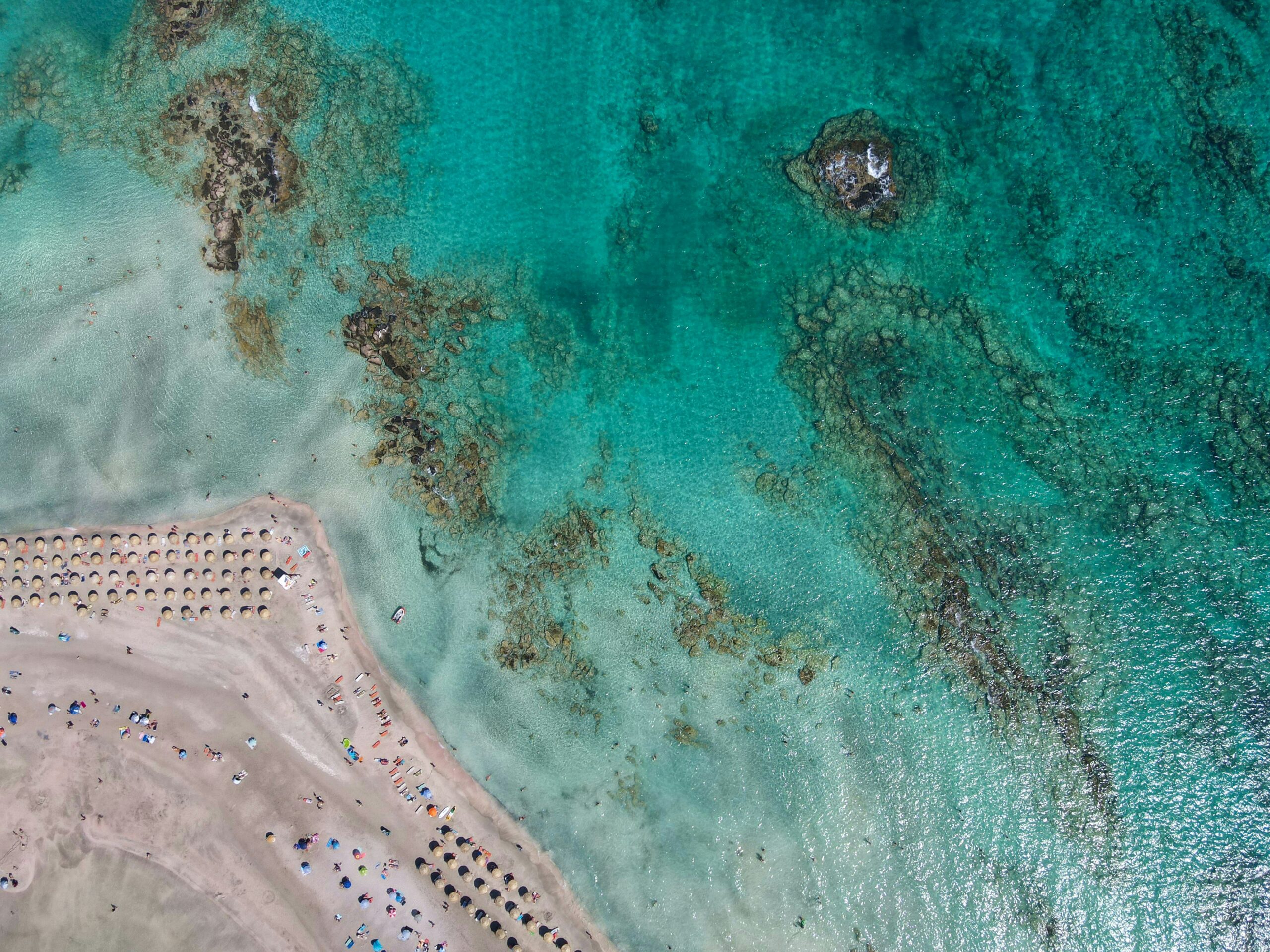 Birds eye view of Elafonsi beach in Greece for Domus Nova and Barnes luxury real estate