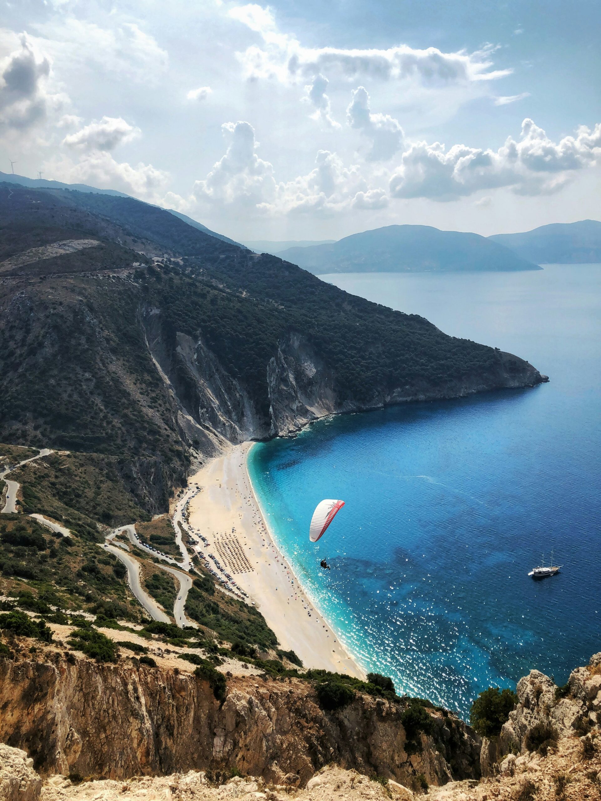 Windsurfing over the beach in Kefalonia in Greece, for Barnes International luxury real estate