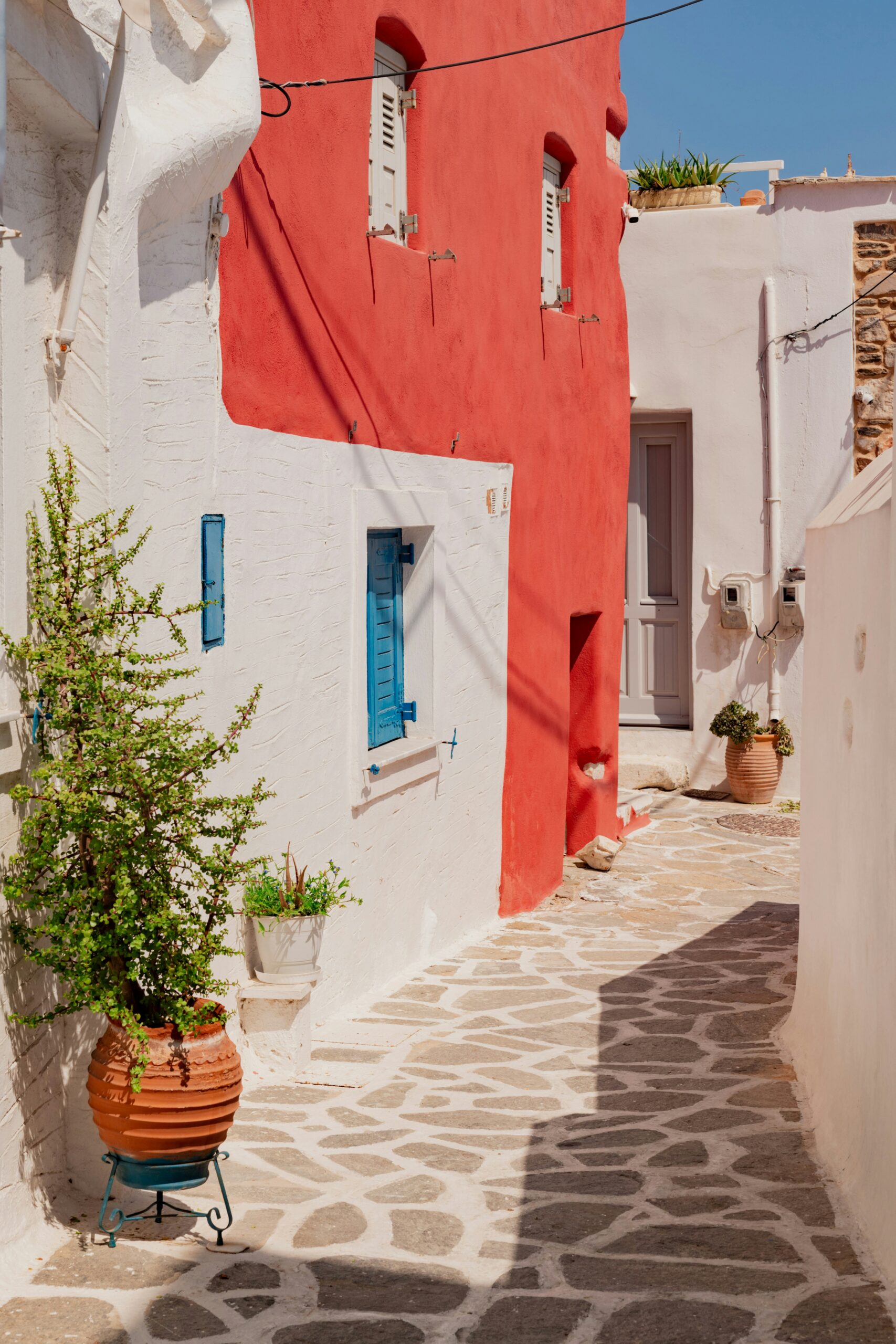 Bright red and whitewashed traditional houses in Rhodes, Greece, for Barnes International luxury real estate