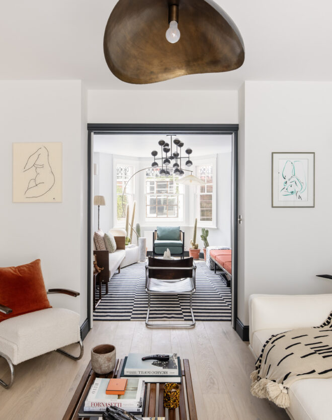 Modern double reception room of a two-bedroom garden apartment for sale in West Kensington