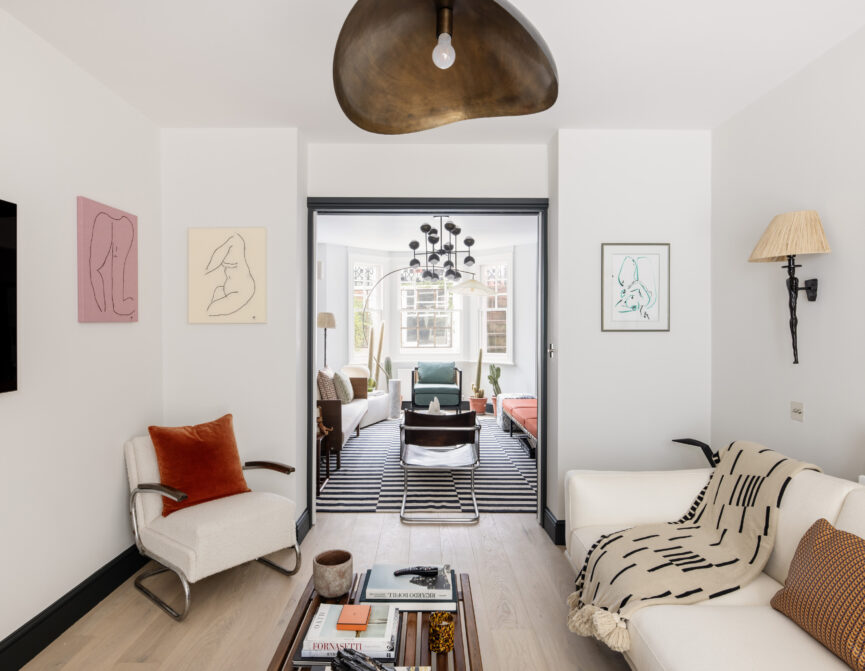 Modern double reception room of a two-bedroom garden apartment for sale in West Kensington