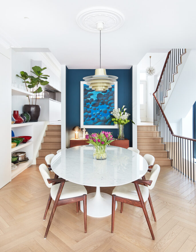 Whitewashed dining room of a design-led home