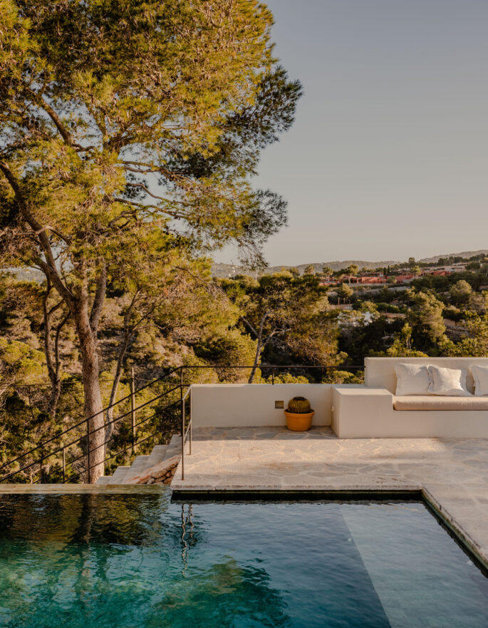 Leafy poolside terrace at a rental villa in Ibiza