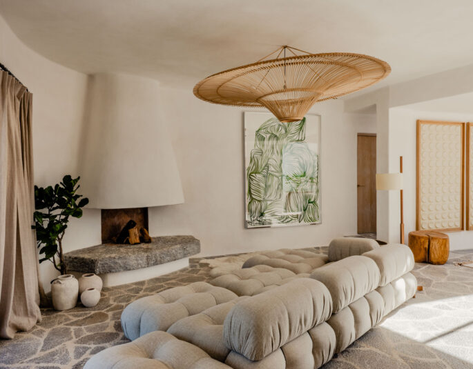 Casa del Arbol living room with custom-made stone fireplace