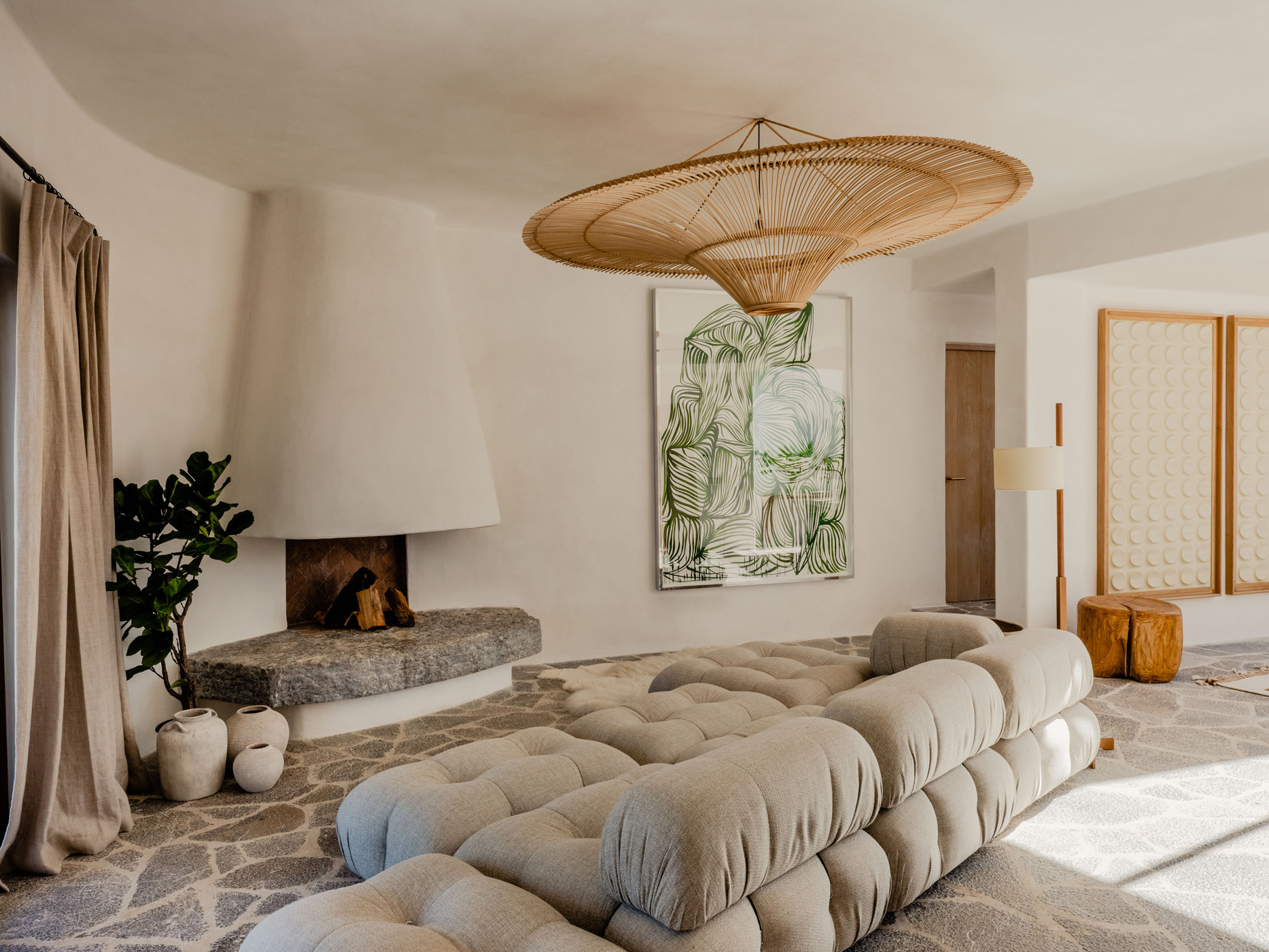 Casa del Arbol living room with custom-made stone fireplace