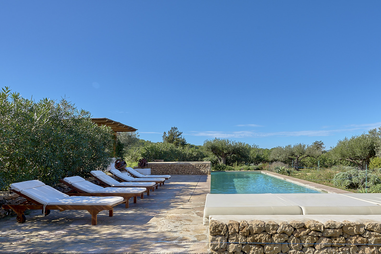 Pool and chillout area of a luxury villa for sale in Ibiza