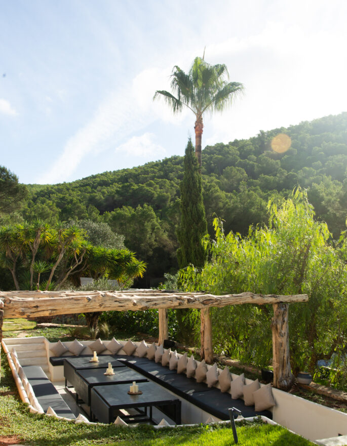 Sunken dining area in the lawn of a tropical villa in Ibiza