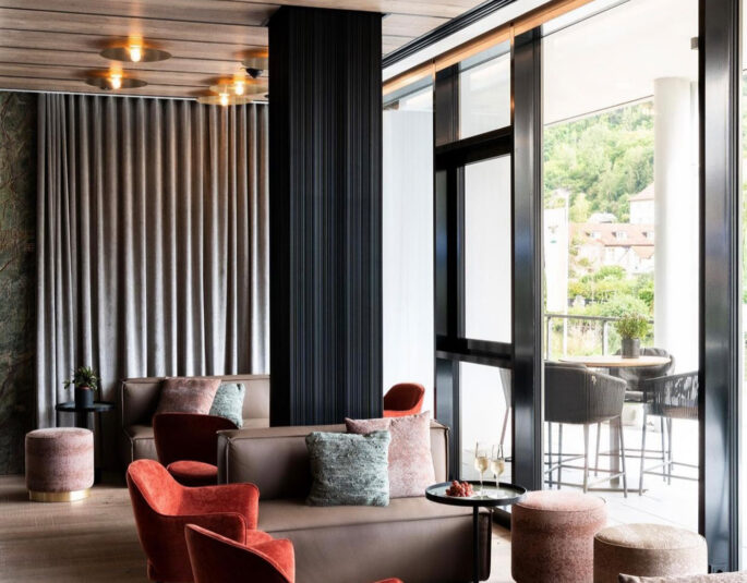 Modern living room with glass windows by luxury interior design studio CONTAIN