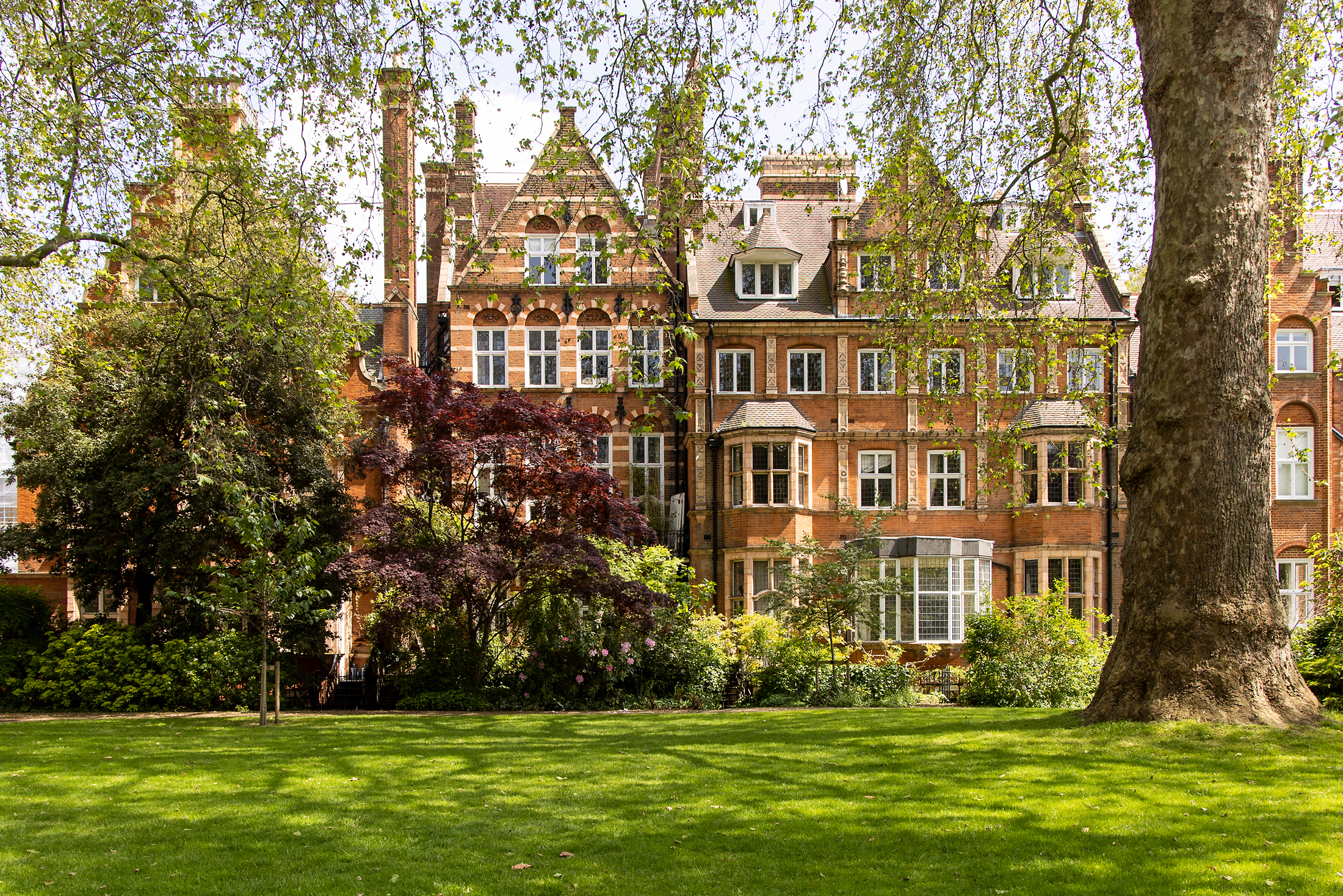 Handsome redbrick façade of a Grade II listed two-bedroom apartment for sale in Kensington