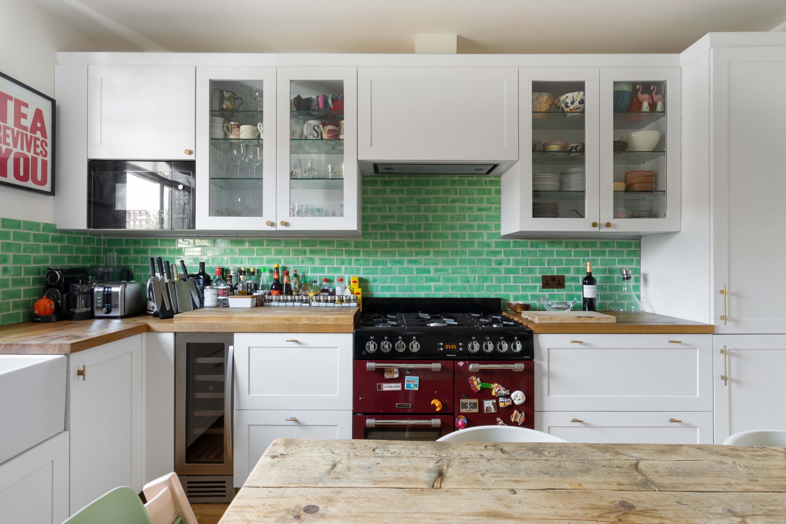 Kensington Park Road kitchen with bright green metro tiles and white cabinets
