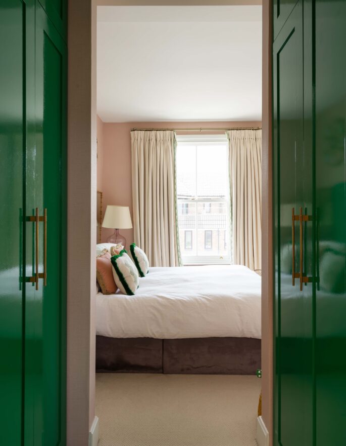 Portrait shot of green wardrobes and master bedroom