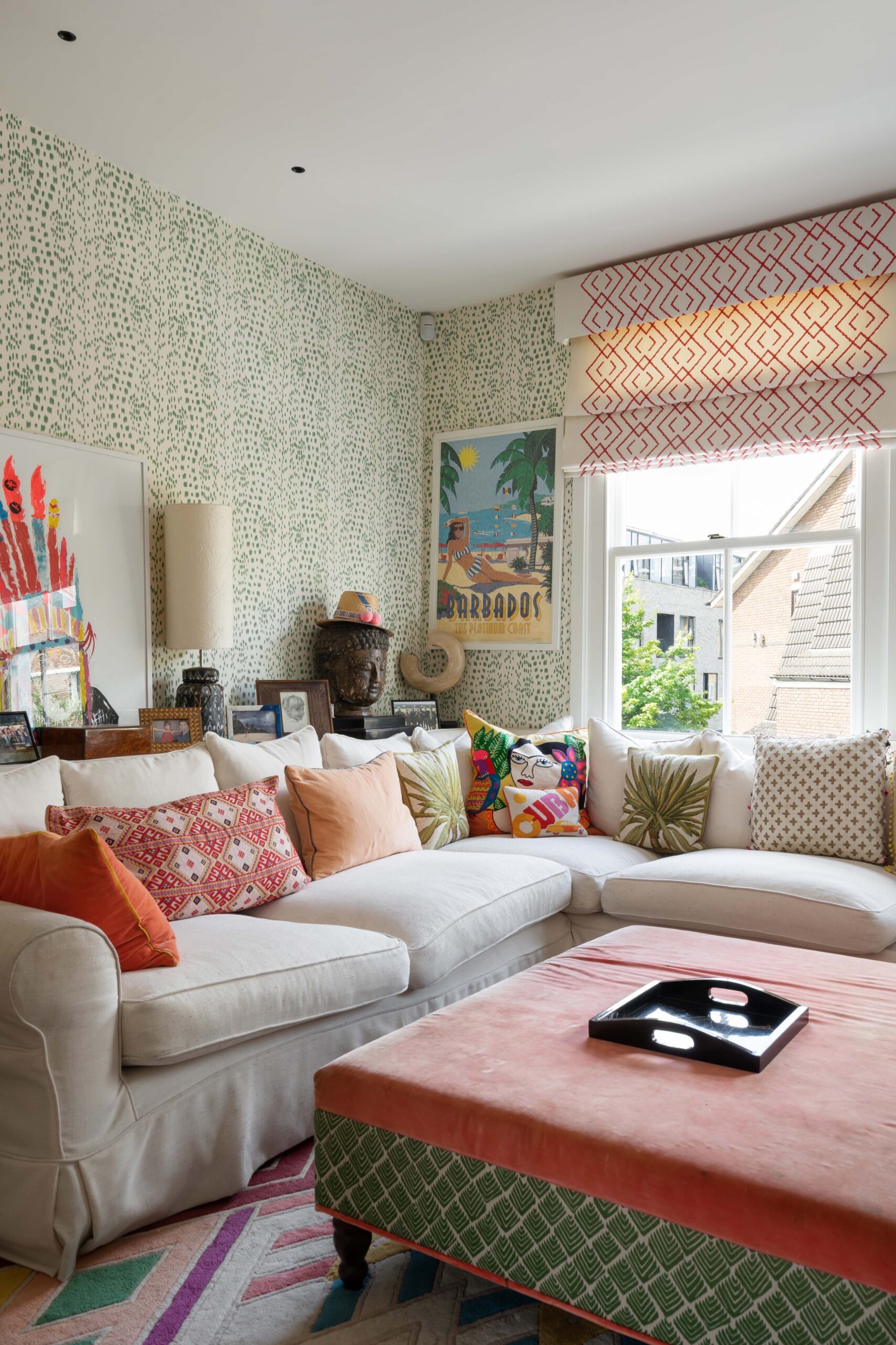 Kensington Park Road living room with pale sofa and patterned wallpaper by Barlow &amp; Barlow