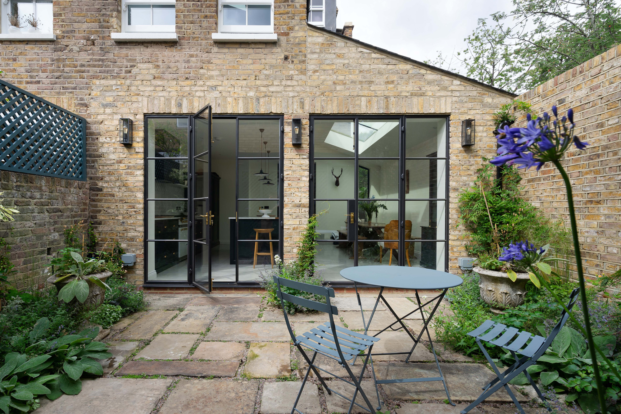 For Rent: Treadgold Street Notting Hill W11 rear façade with patio and Crittall windows