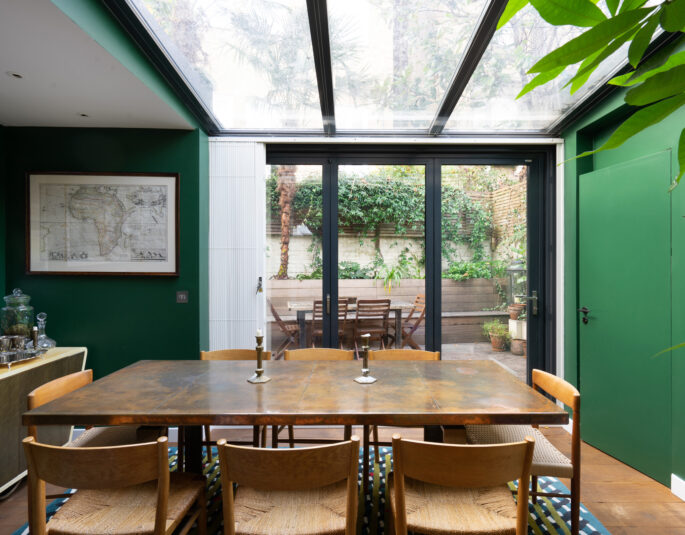 For Sale: Pembridge Mews Notting Hill W11 bold industrial contemporary dining room with green walls and glass ceiling