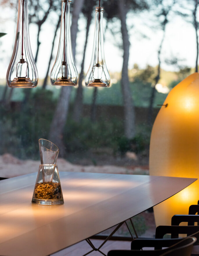 Pendant lighting over a table on a sheltered terrace