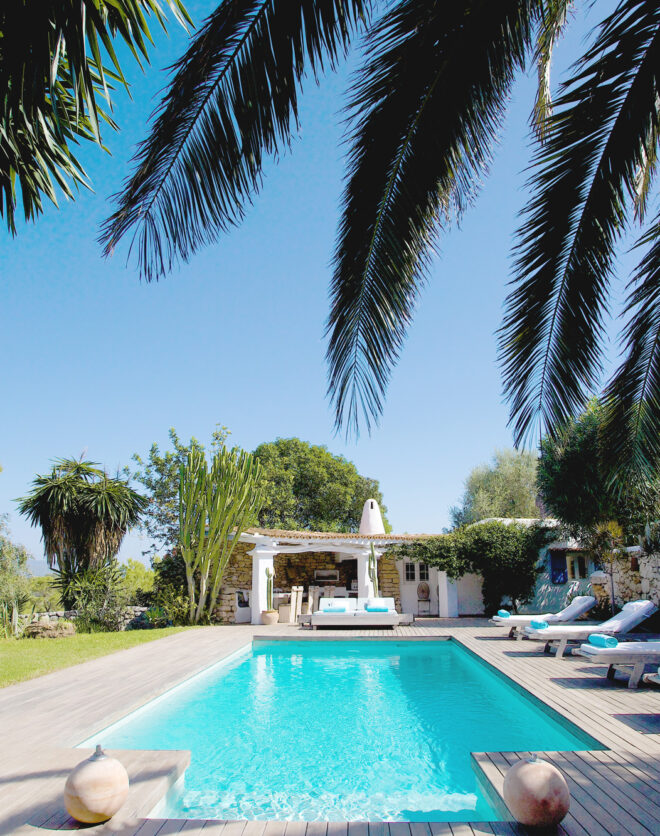 Flanked by greenery, the pool of a luxury villa in Ibiza