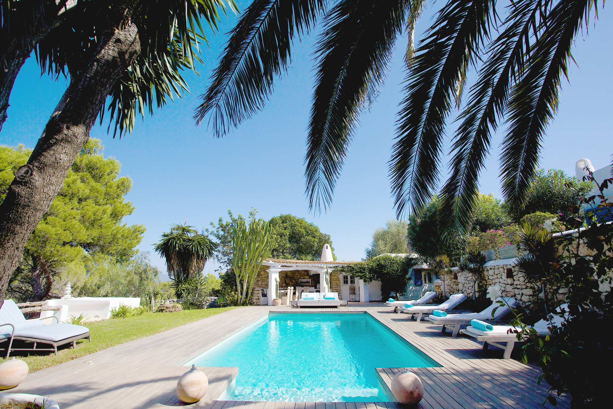 Flanked by greenery, the pool of a luxury villa in Ibiza