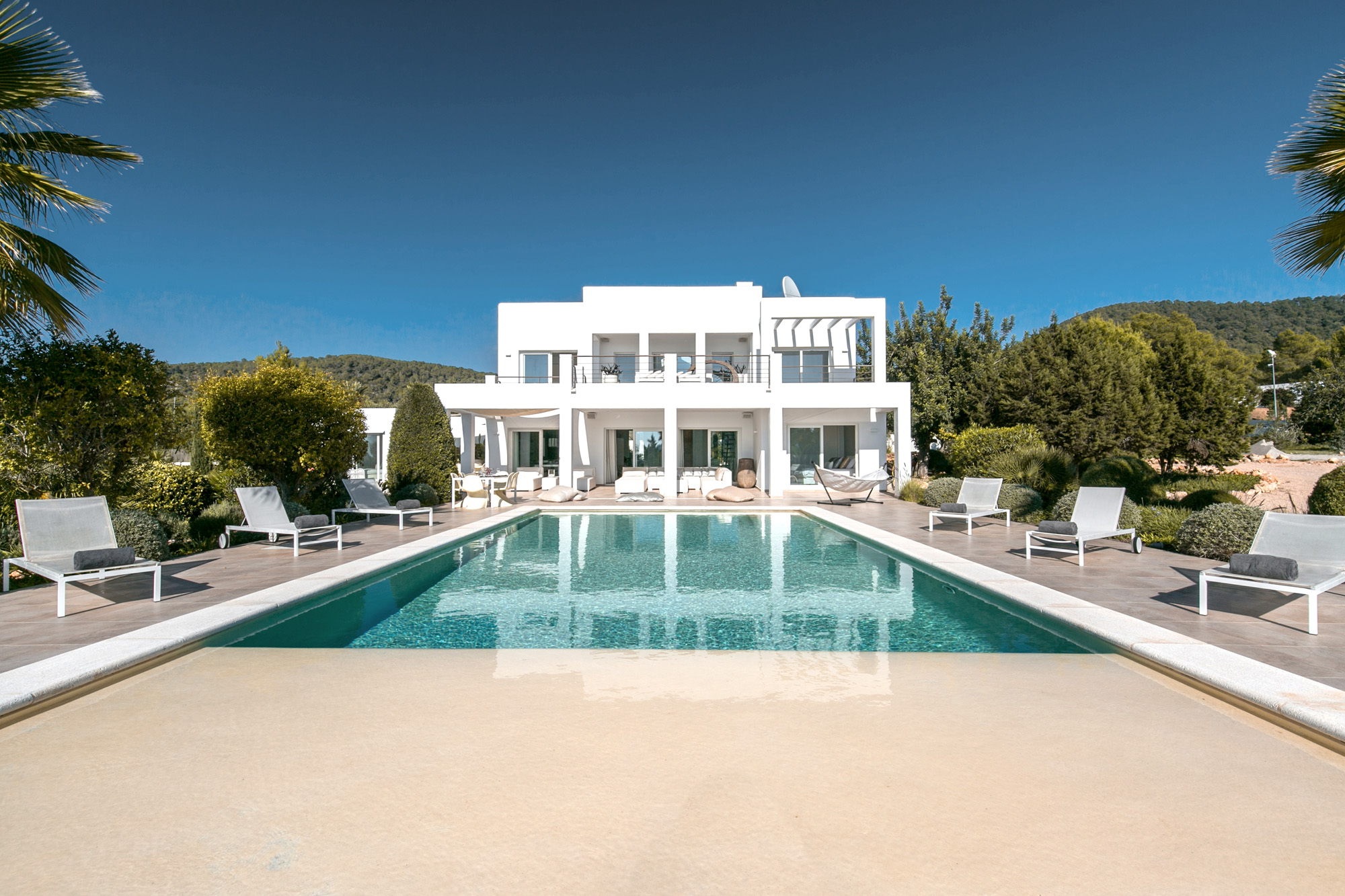 Pool in front of a luxury rental villa in Ibiza