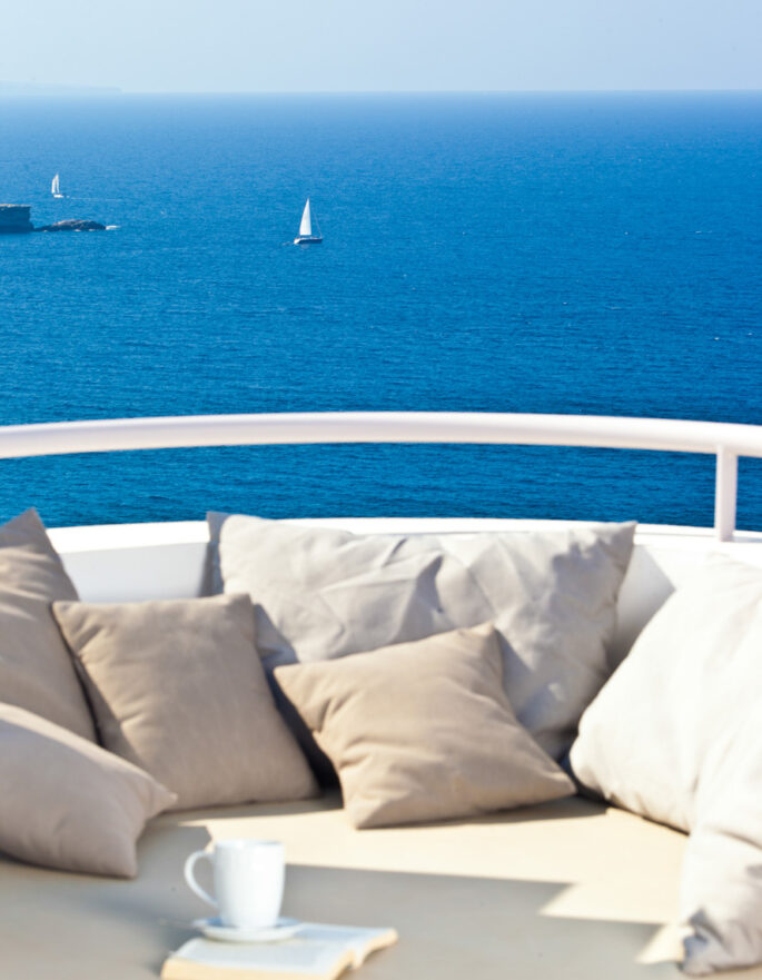 View over the sea from the day bed of a luxury holiday home in Ibiza