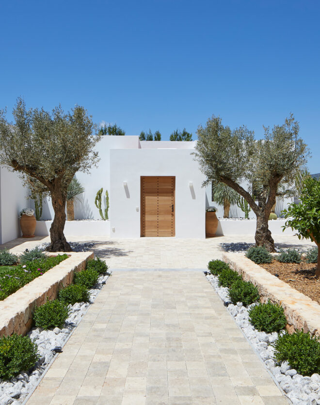 Symmetrical exterior entrance to a design-led rental villa in Ibiza