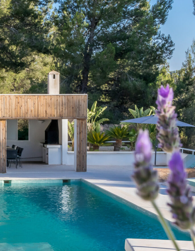 Lavender from a herb garden fragrances the pool area of a luxury rental villa