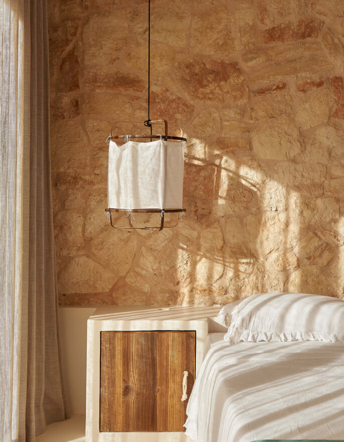 Stone wall in the bedroom of an Ibiza finca