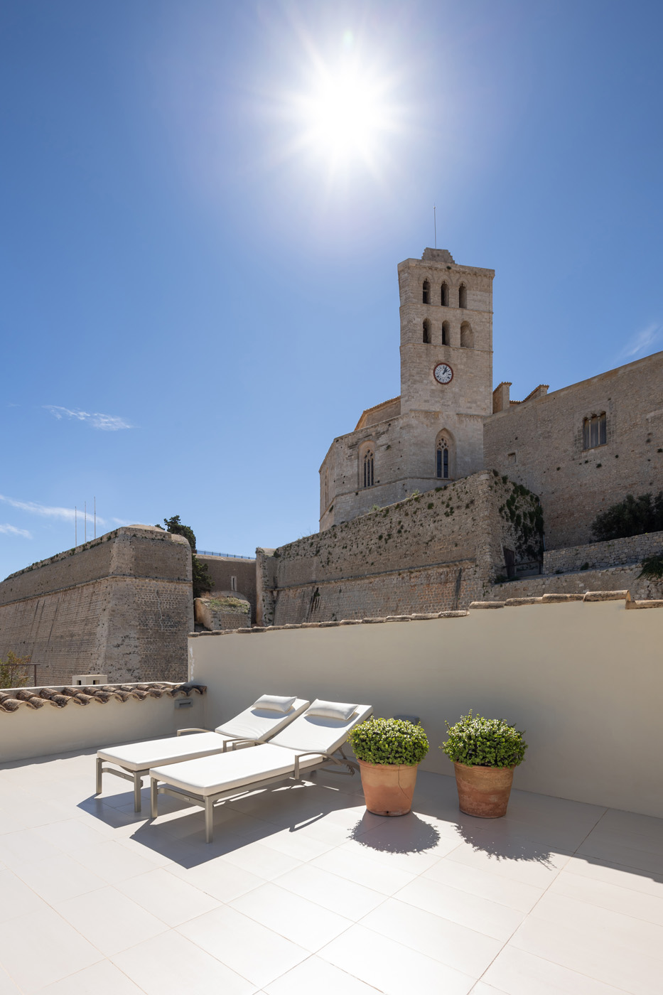 Sunny roof terrace of a luxury townhouse in Dalt Vila sits lower only than Catedral de Santa Maria in Ibiza