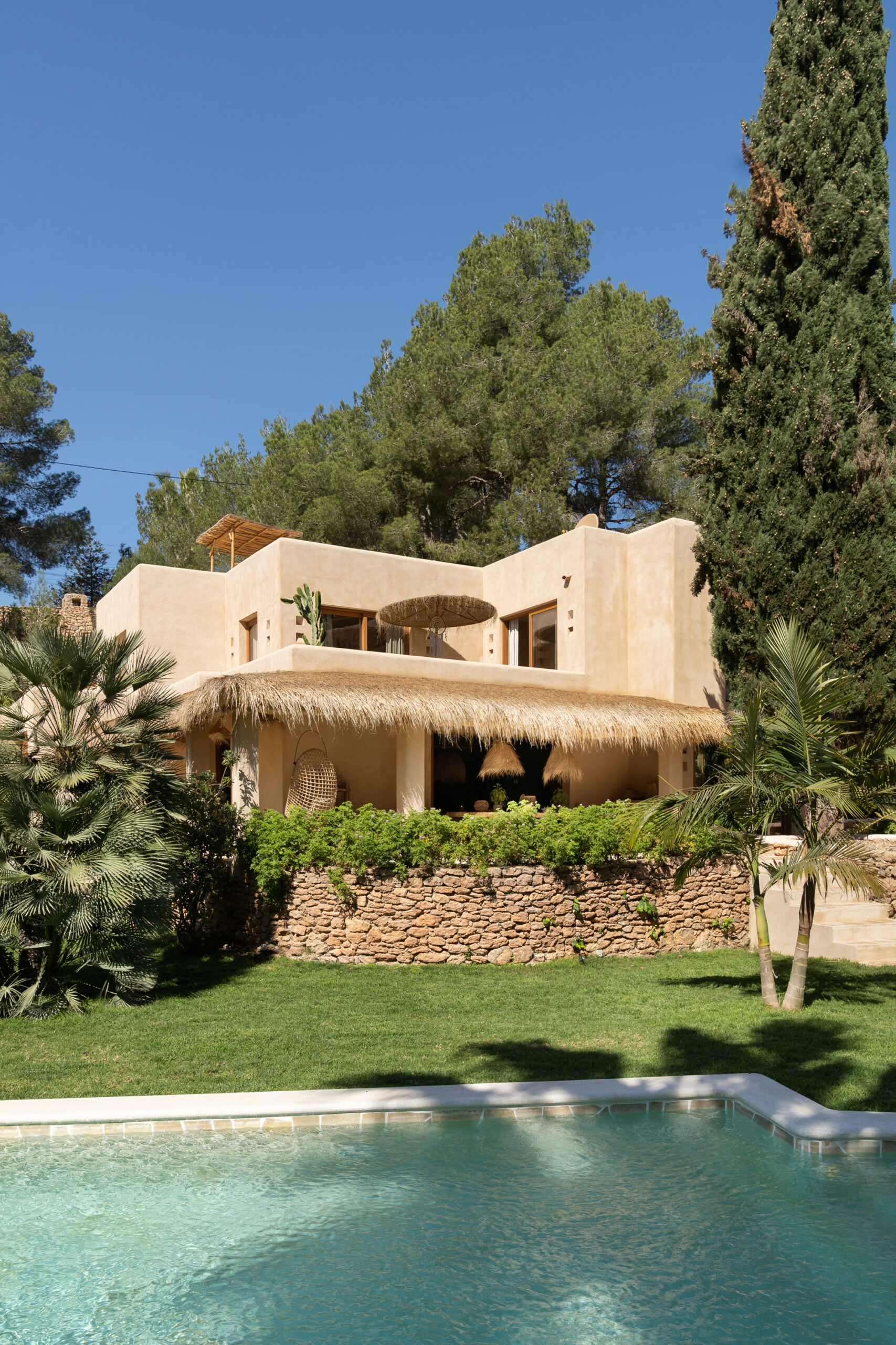Front and swimming pool at Villa Nomad, a luxury villa for sale in Ibiza
