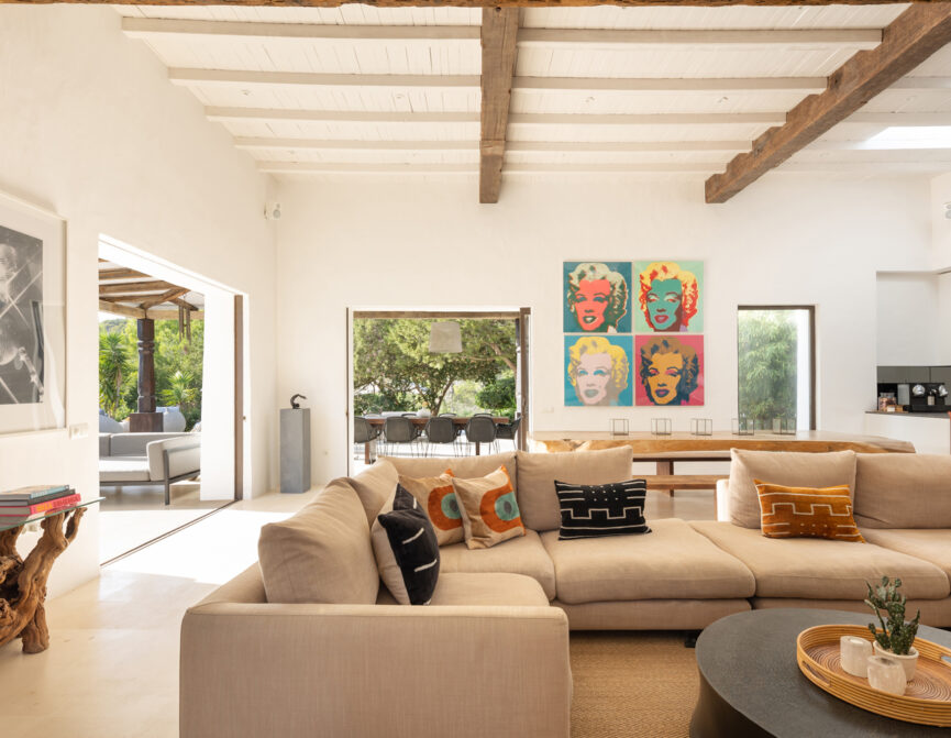 Can Bikini living room with pop art print and cream sofas