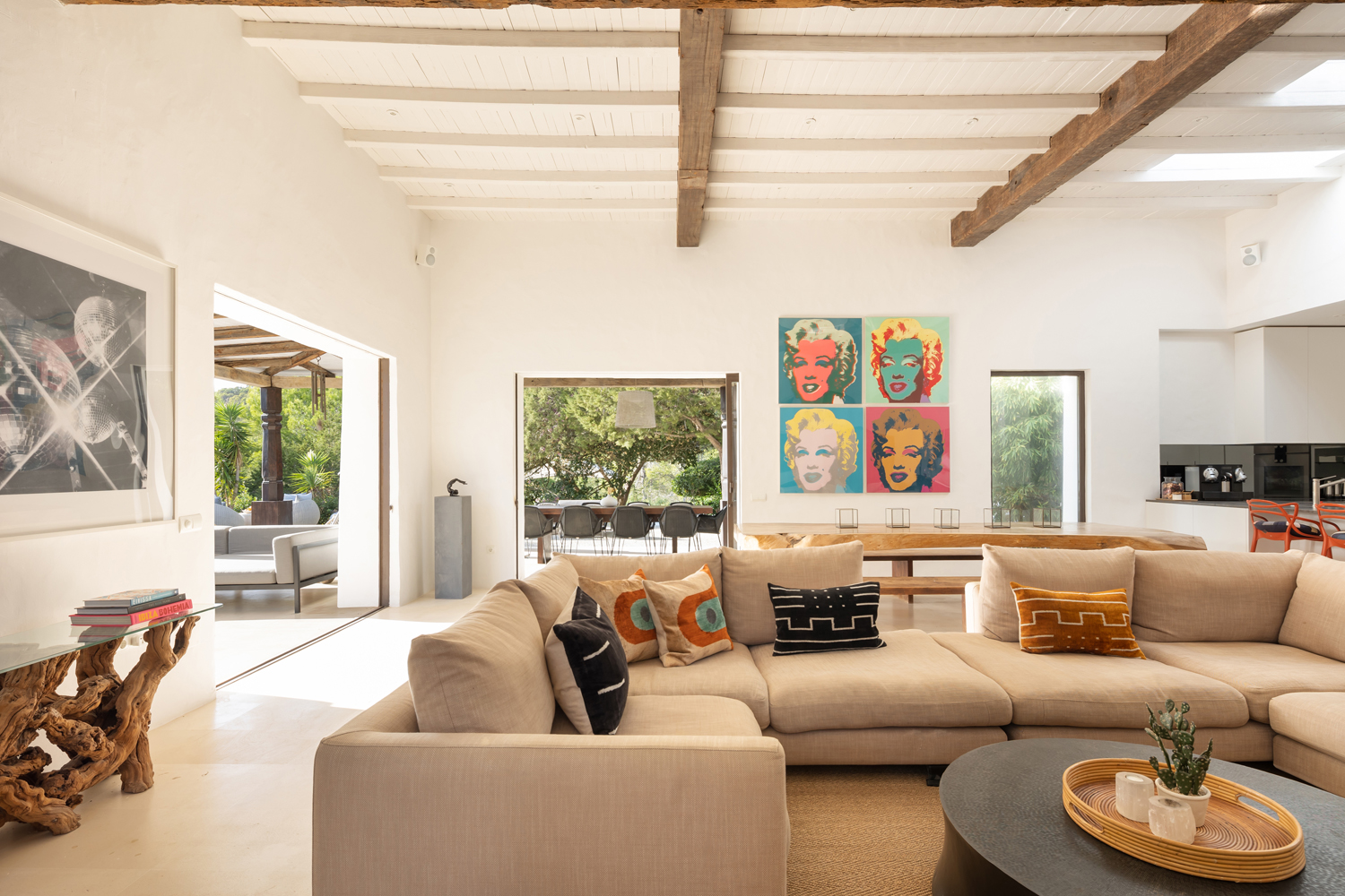 Can Bikini living room with pop art print and cream sofas