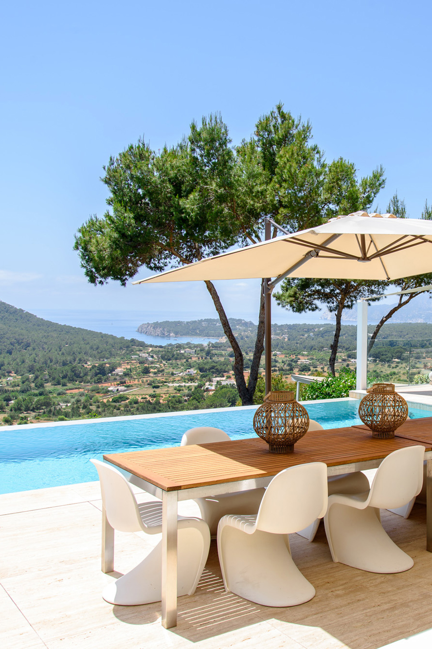 Dining terrace and pool of an upscale Ibiza villa