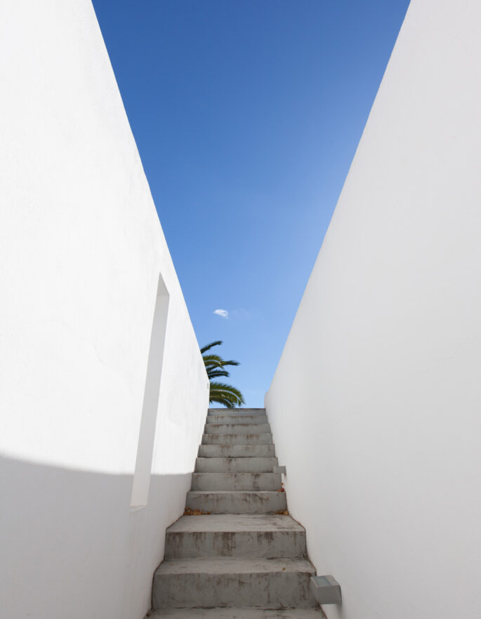 Steps down from a terrace at a luxurious Ibizan villa