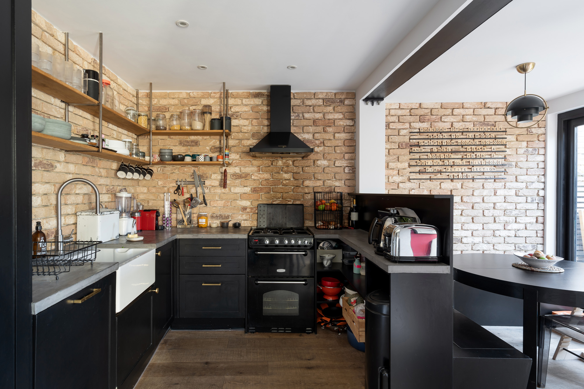 For Sale: St Marks Road North Kensington W10 stylish monochromatic kitchen and exposed brick wall