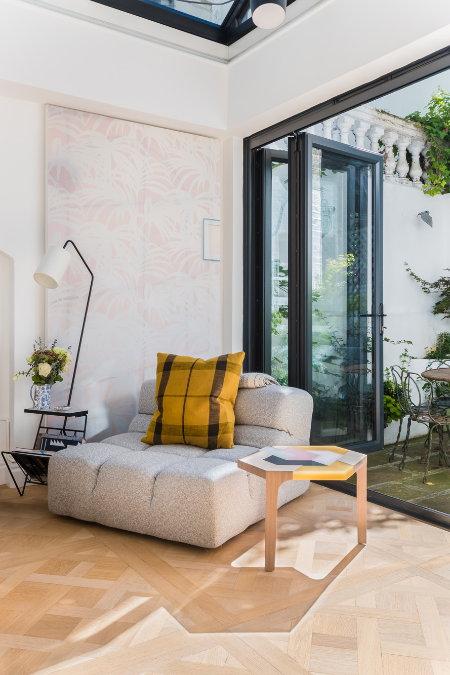 For Sale Alexander Street Notting Hill W2 modern armchair and full-height windows to the garden