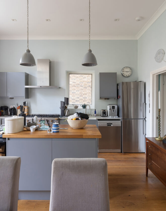 For Sale: Leamington Road villas Notting Hill W11 contemporary kitchen with blue island and pendant lights