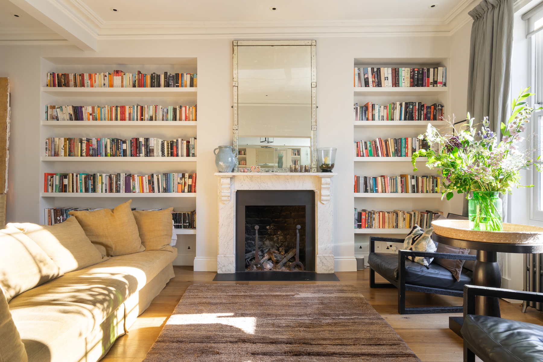 For Sale: Portland Road W11 Living Room with bookcases and fireplace