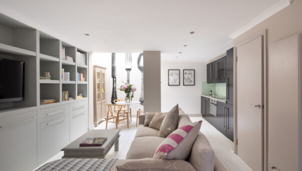 For sale, Pottery Lane London Holland Park W11 living room with shelving and sofas