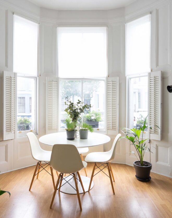 For Sale: Westbourne Park Road Notting Hill dining table in bay window with house plants