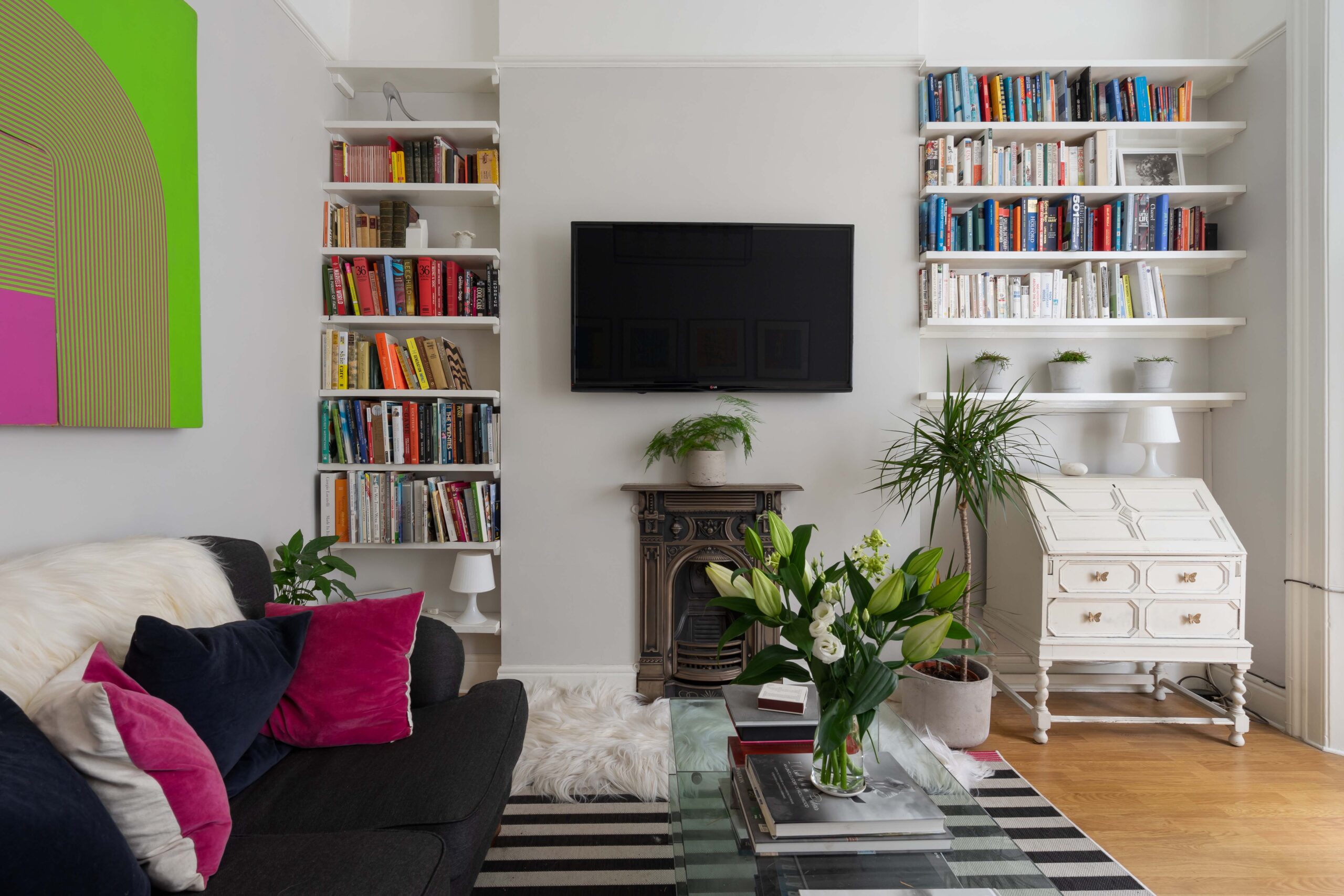 For Sale: Westbourne Park Road Notting Hill W11 modern reception room with bookcases and stylish furniture