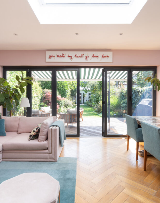 For Sale: Wormholt Road Shepherd's Bush W8 modern kitchen and living room with pink walls and a skylight