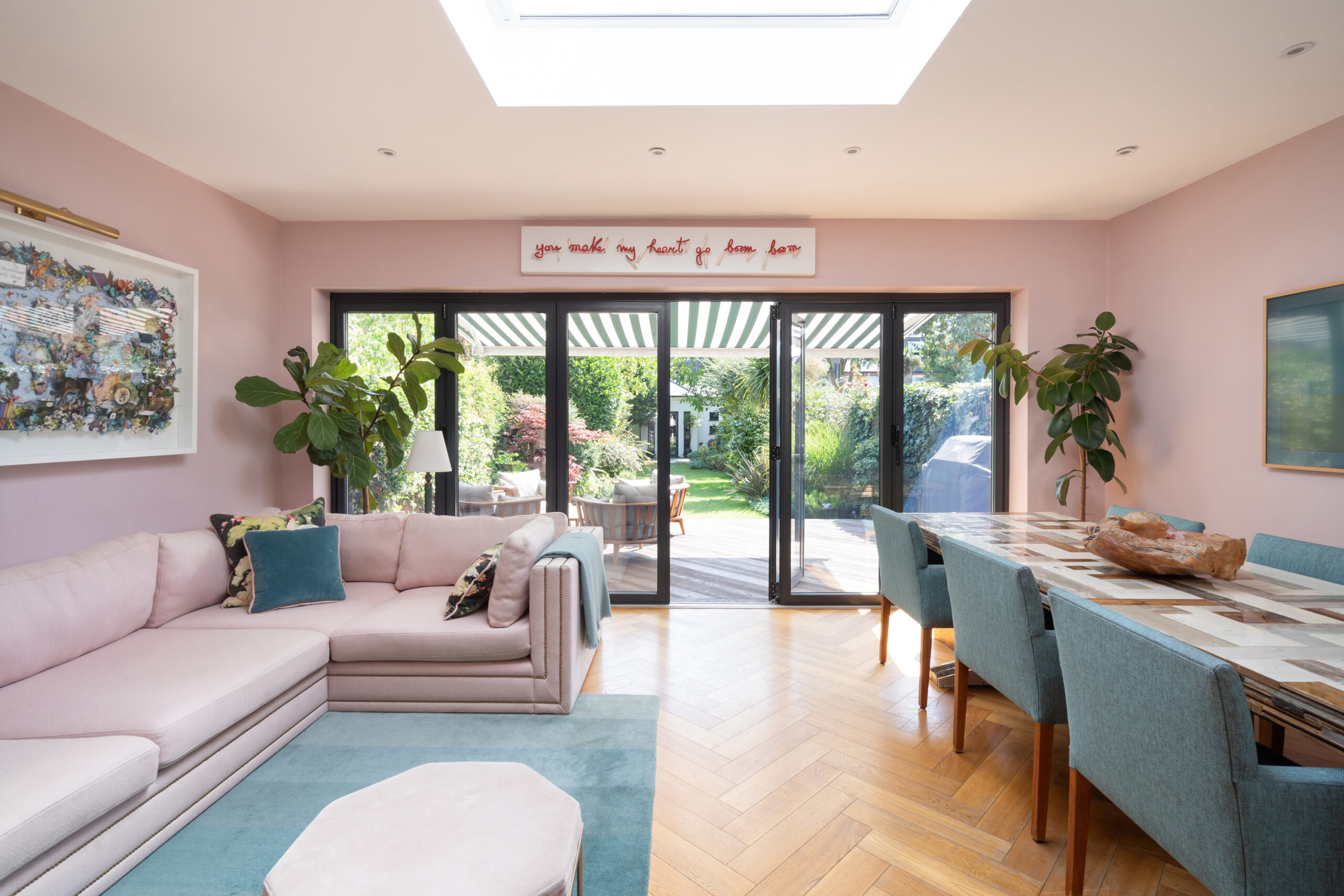 For Sale: Wormholt Road Shepherd's Bush W8 modern kitchen and living room with pink walls and a skylight