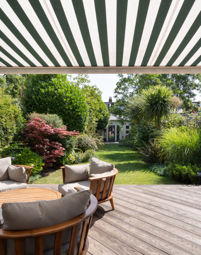 For Sale: Wormholt Road Shepherd's Bush W8 garden with striped veranda and wooden decking