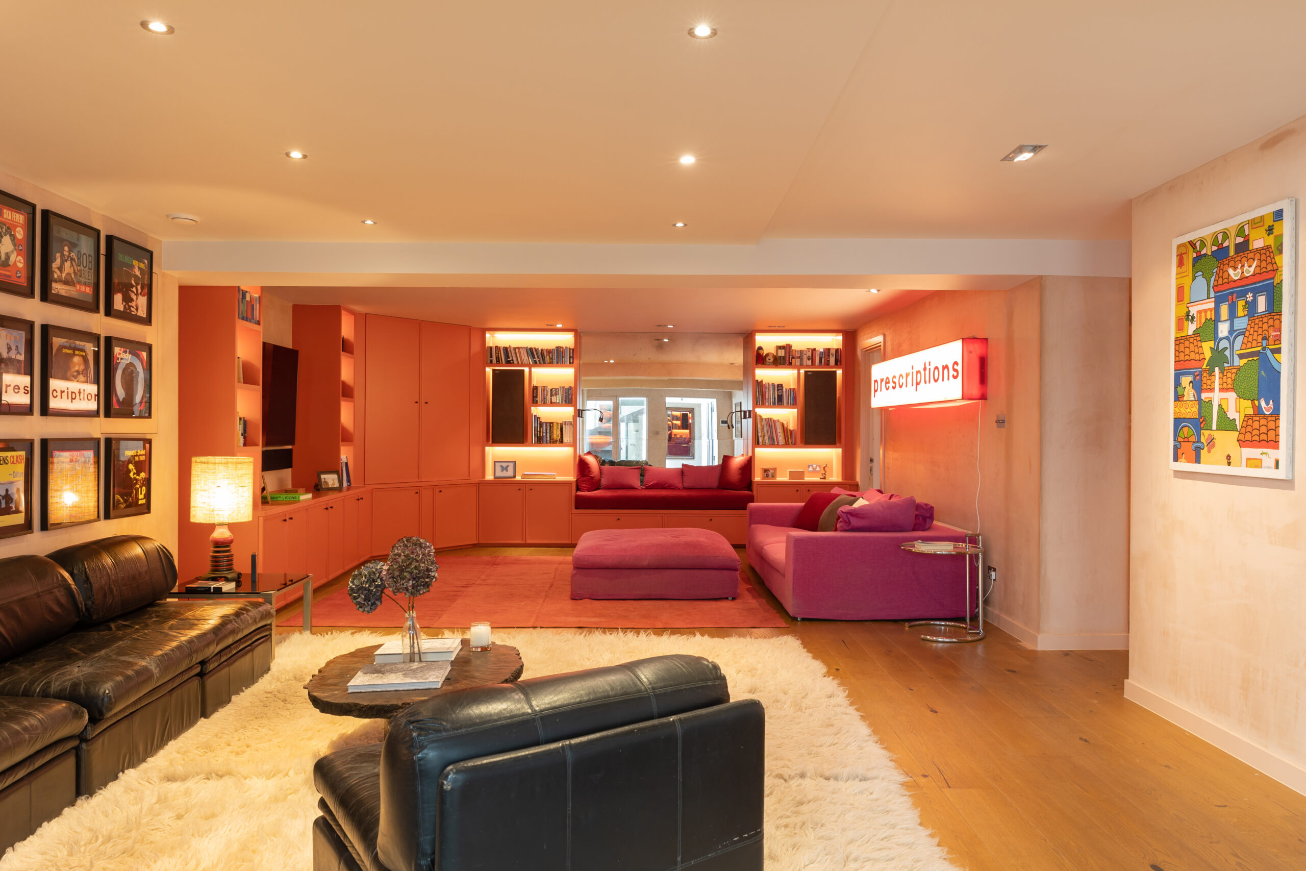 For Sale: Wornington Road North Kensington W10 living room with orange walls and leather sofas