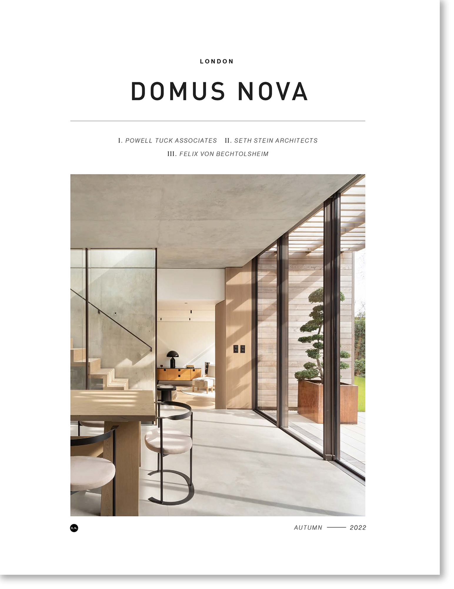 A magazine cover featuring a modern, industrial kitchen and reception room