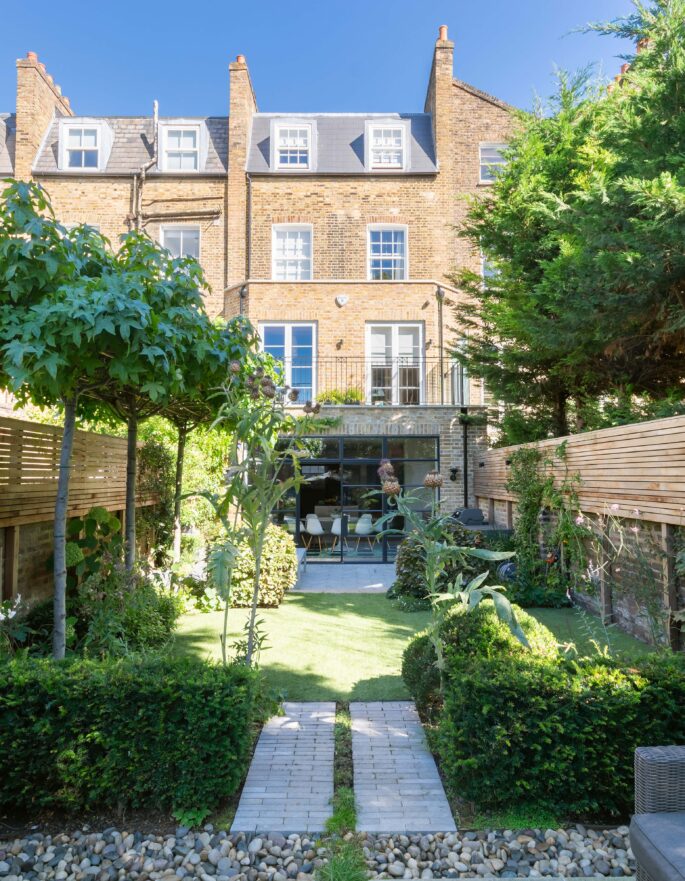 Hammersmith Grove private garden with seating area and lawn